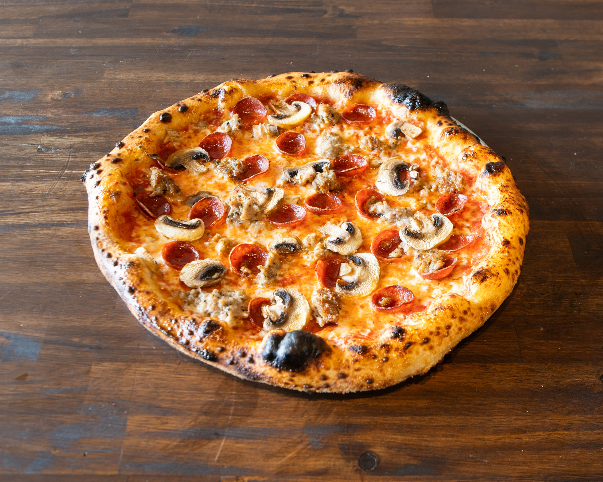 The Jen pizza with pepperoni, sausage and mushrooms