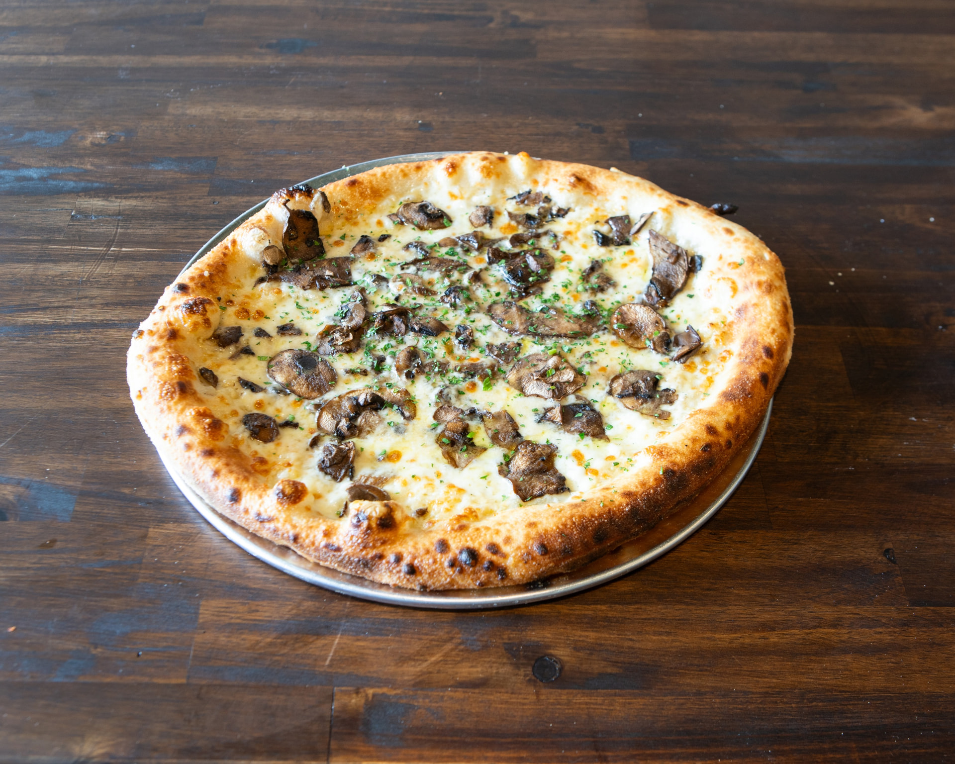 Mushroom and truffle pizza with herbs