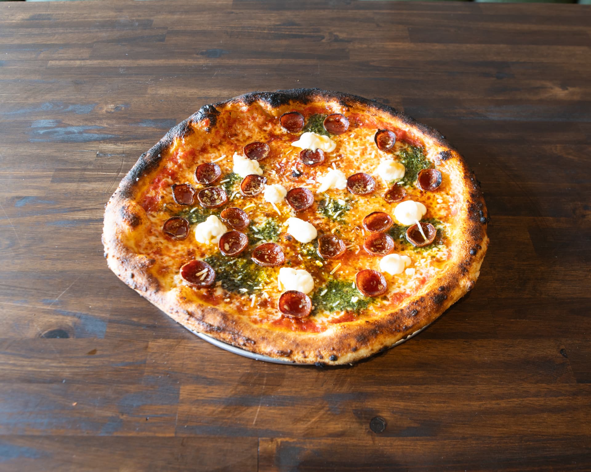The PPG pizza with pepperoni, pesto, stracciatella and hot honey