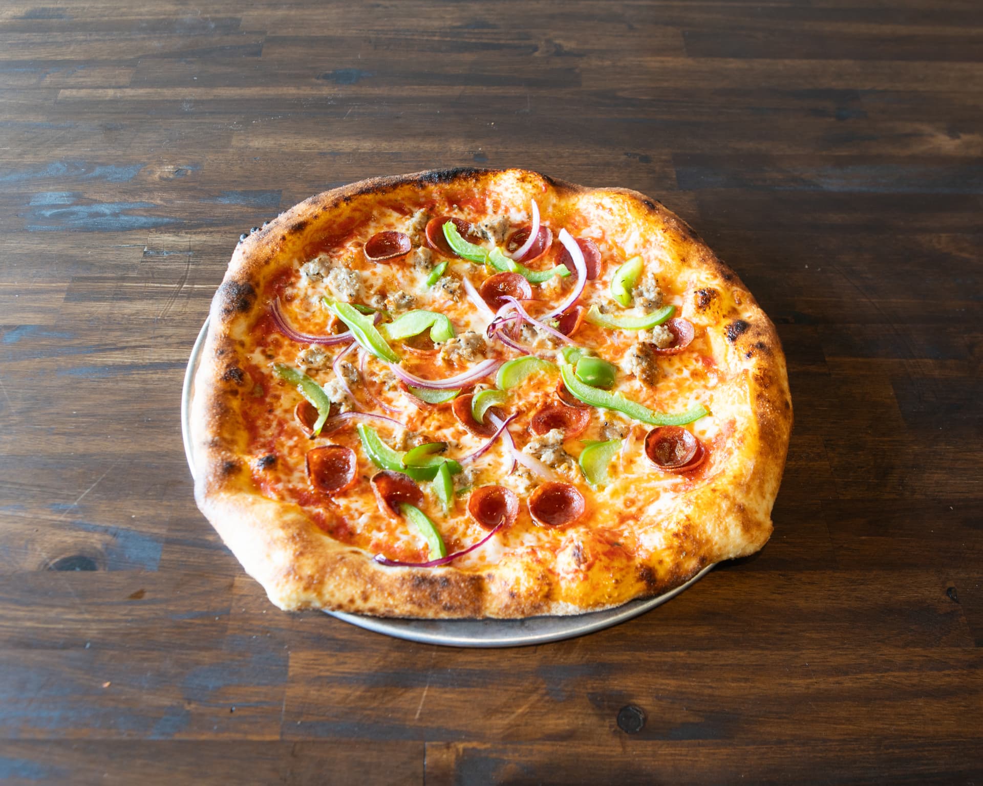 The King pizza with sausage, pepperoni, onion and green bell pepper